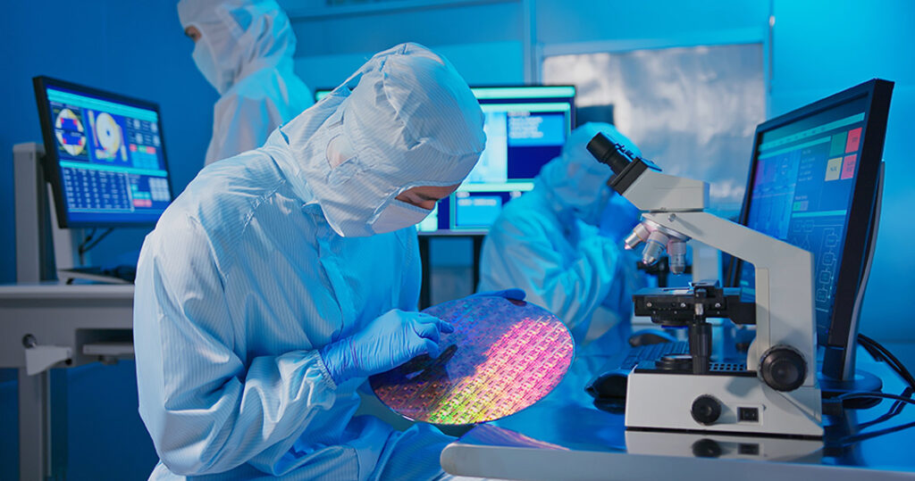 technician holding a Wafer for quality managemnet